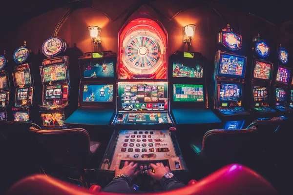 A close-up shot of golden coins falling around a spinning roulette wheel, representing immersive casino action at SAFI.